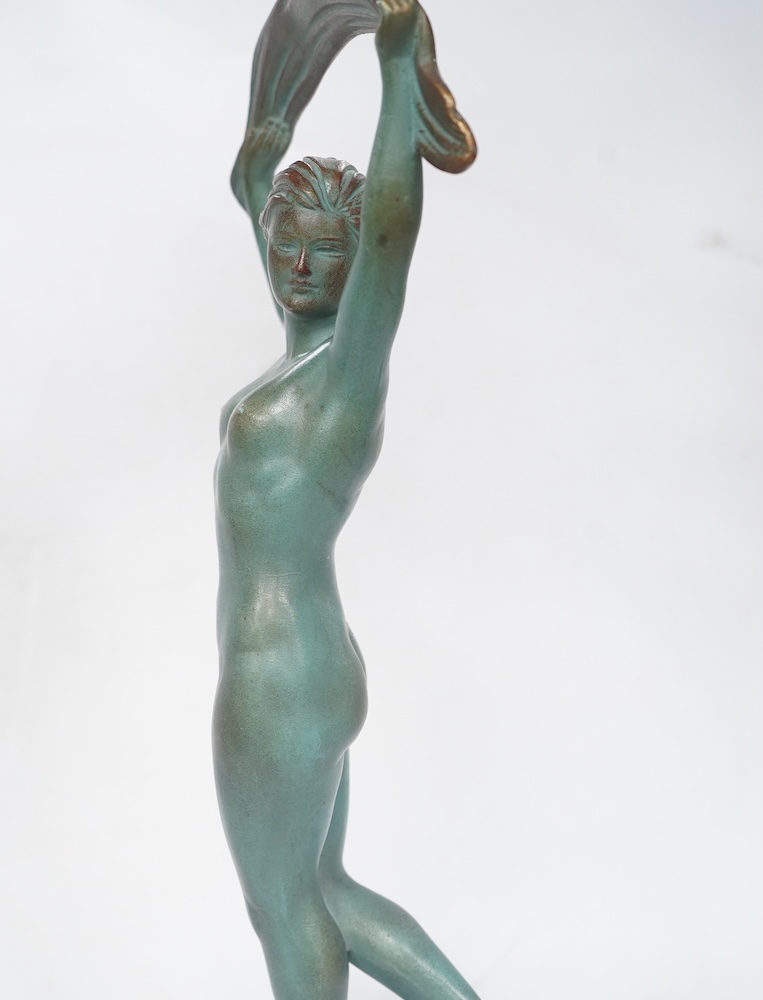A French Art Deco bronze model of a dancer, green patination, on black marble base. 33cm high. Condition - minor chip to base